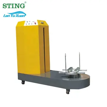 Автоматическая машина для упаковки поддонов в стрейч-пленку для багажа в аэропорту